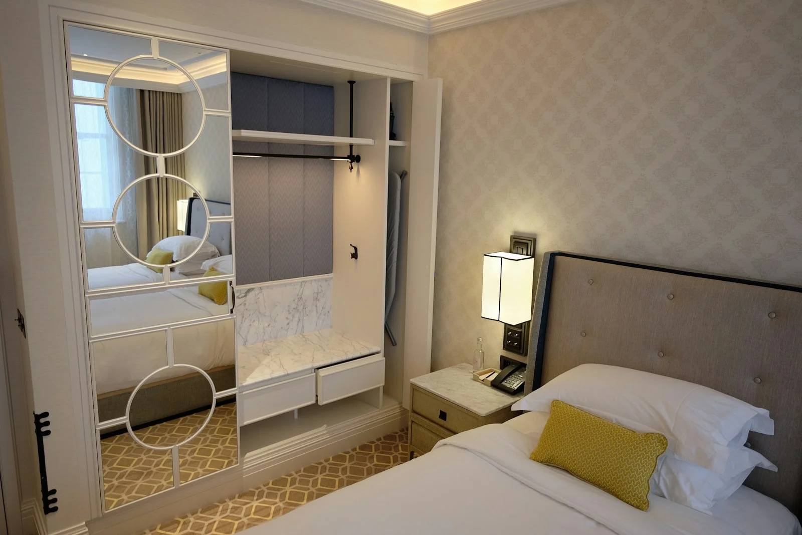 white bed near white wooden door white bed near white wooden door