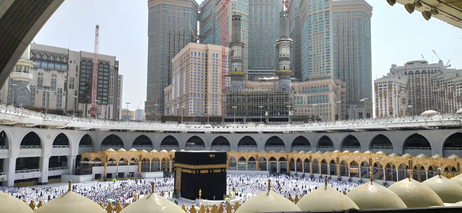 a view of the inside of a mosque in the middle of a city a view of the inside of a mosque in the middle of a city