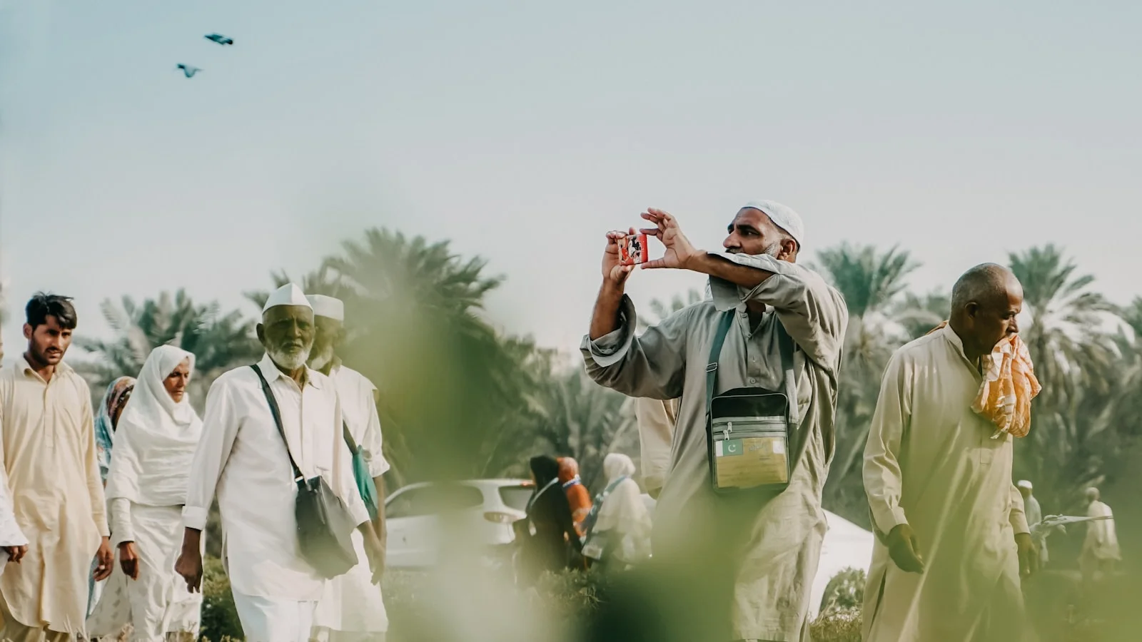 a man taking a picture of a group of people a man taking a picture of a group of people